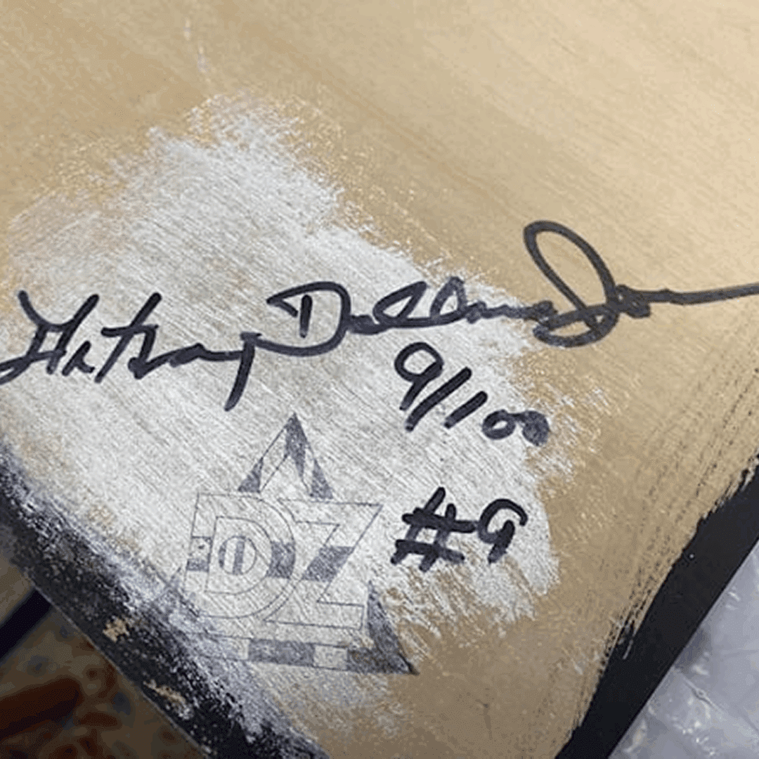 Signature and date on a painted canvas corner.