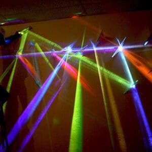 Colorful laser lights on a wall display.