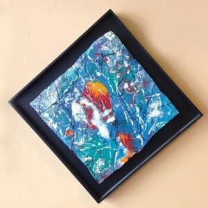 Abstract painting with vibrant colors in frame.