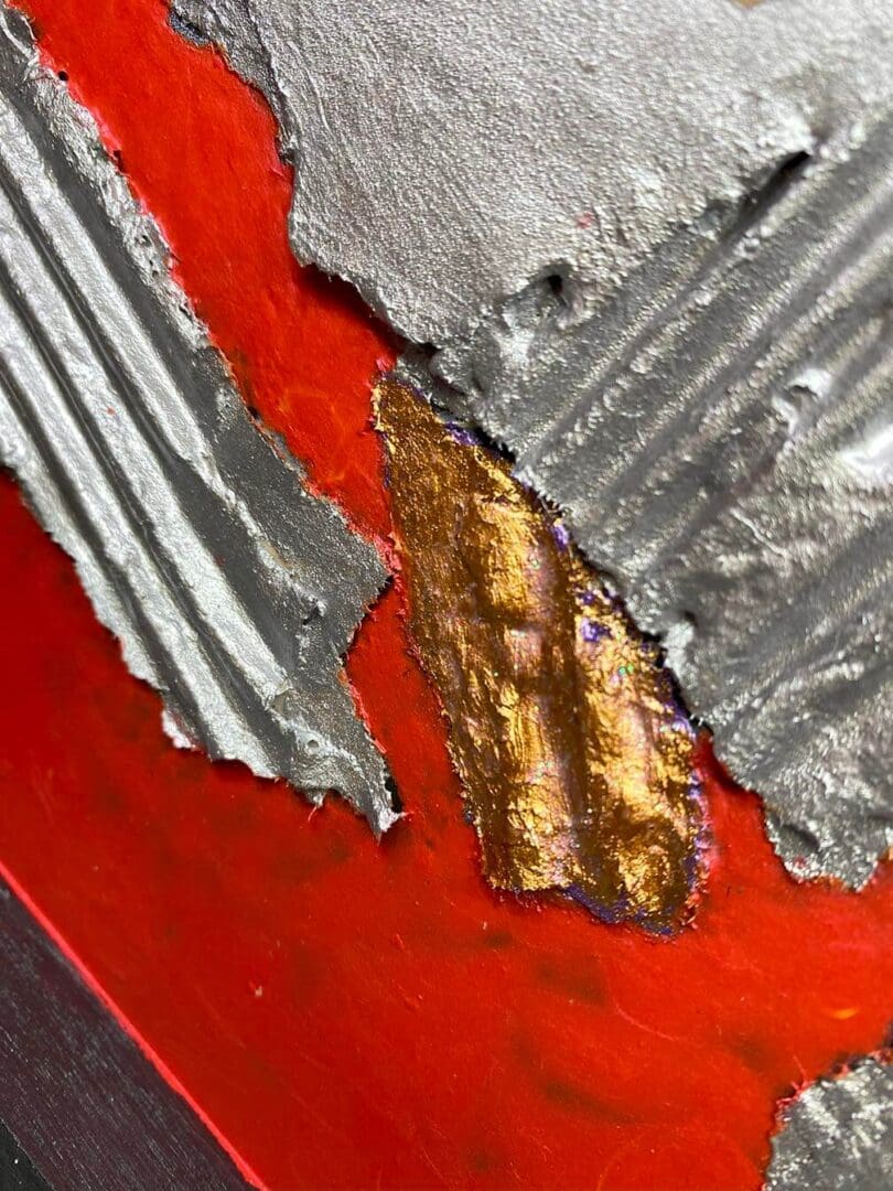 Close-up of torn corrugated metal with red and rust background.