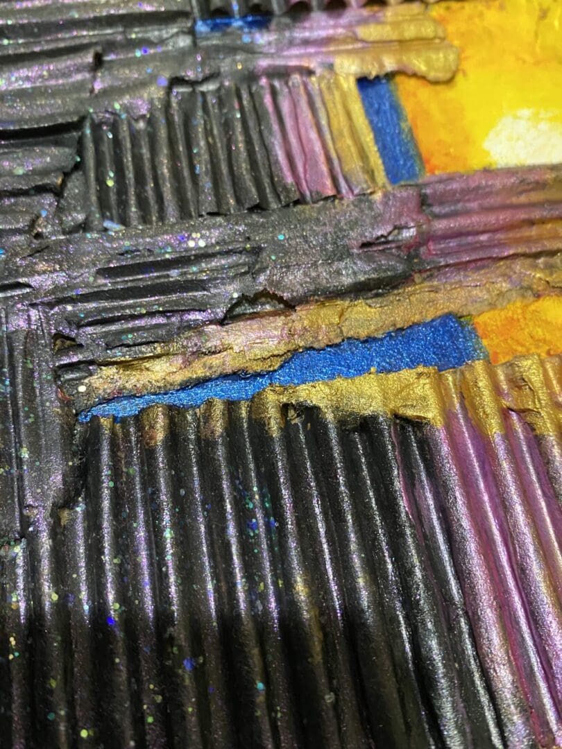 Close-up of a textured, multicolored abstract painting with ridged patterns.
