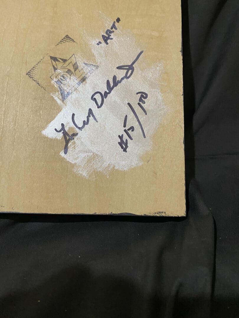 Handwritten note with a date on a worn paper corner.