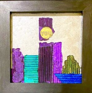 Colorful city skyline drawn with markers on paper and framed.