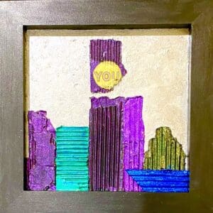 Colorful city skyline drawn with markers on paper and framed.