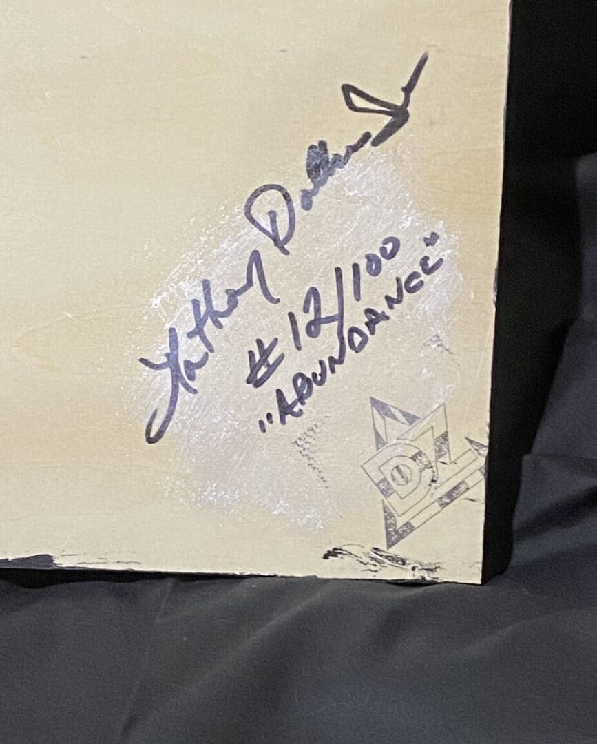 Signed and numbered artwork with artist's signature and edition details.