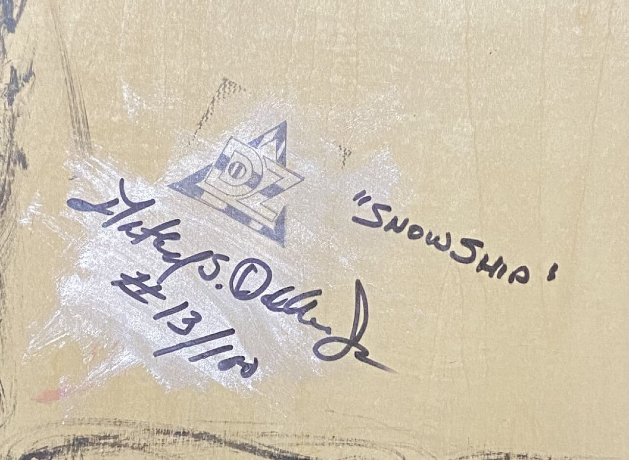Close-up of a signature and date on a textured surface.