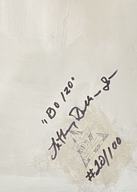 Handwritten note with date and signature on paper.