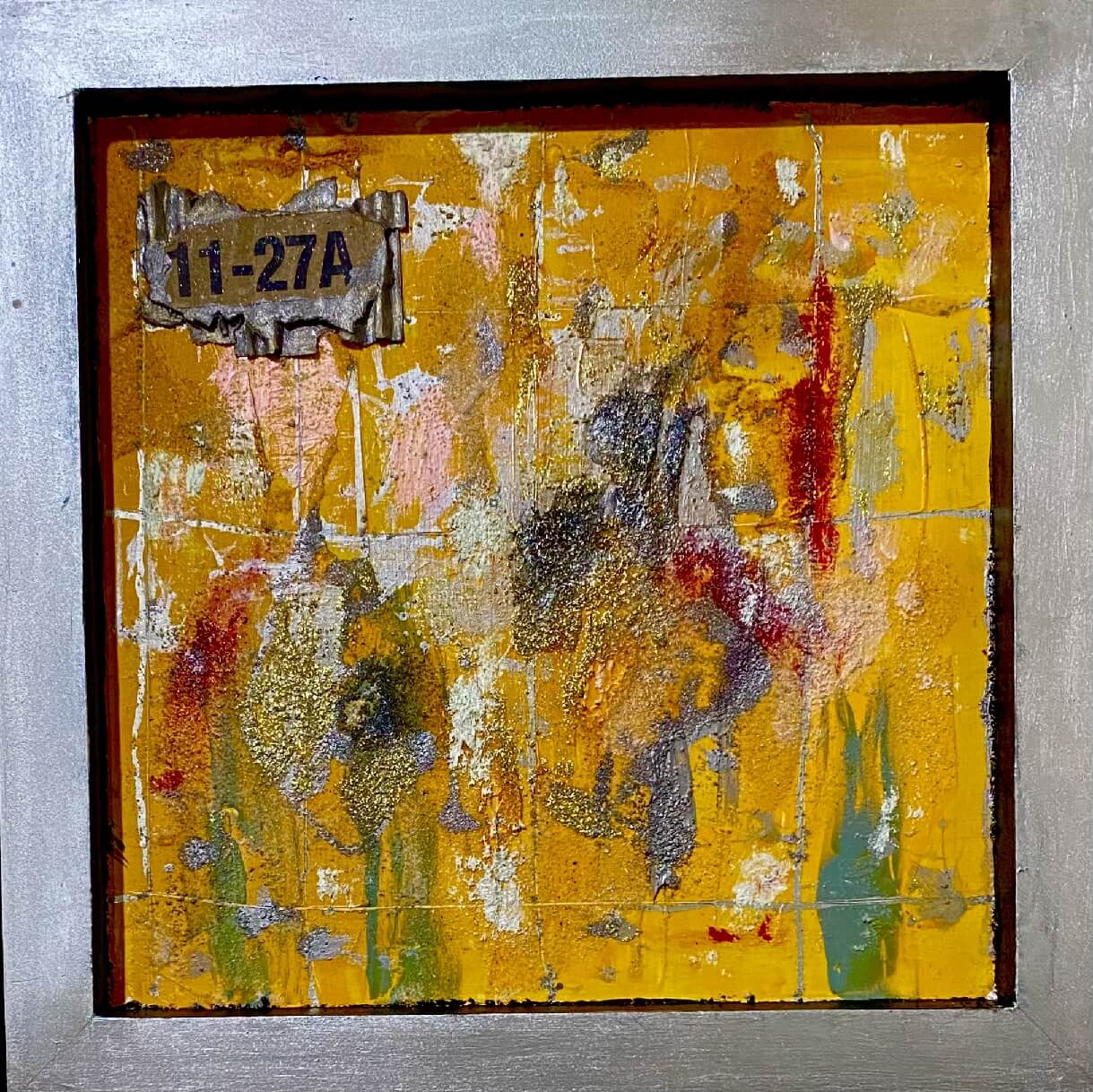 Abstract painting with yellow tones and textured layers.
