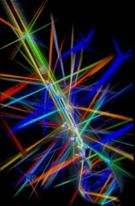Colorful neon light streaks intersecting against a black background.