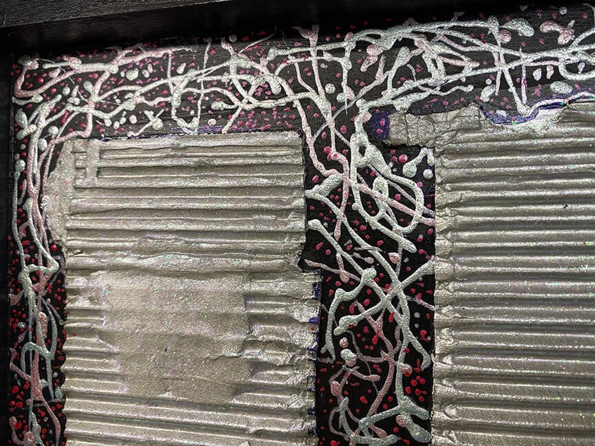 Abstract textured painting with silver and red.