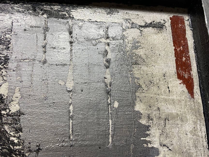 Abstract textured wall with peeling paint.