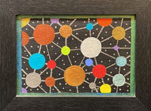 Framed abstract painting of connected colorful circles